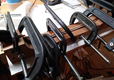 Neck laminations being epoxied