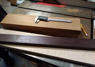 Neck woods being prepared for lamination