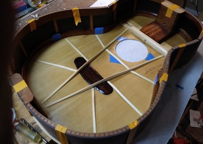 Rim radiused, notched, and prepared for soundboard