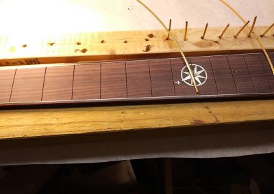 Fret wire being cut to size