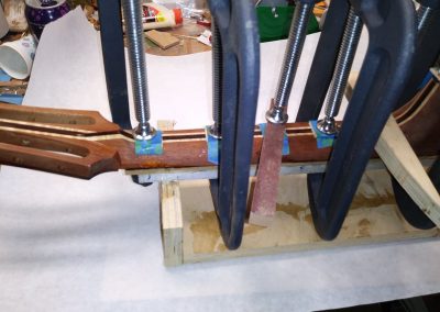 Fretboard being glued onto the neck