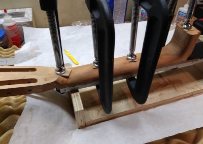 Fretboard is being glued onto the neck (2)