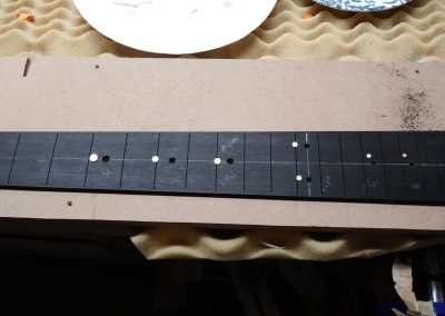 Gold MOP dots ready to be inlaid into the fretboard