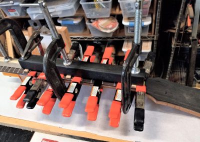 Fingerboard being glued onto the neck