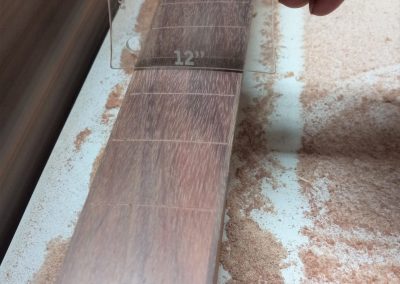 Fretboard radius is being verified to a 12 inch radius