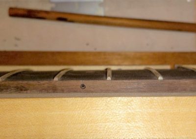Fretboard side market dots positions have been marked and holes drilled