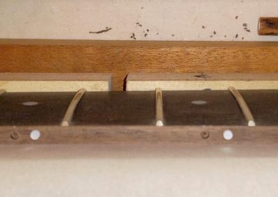 Position dots in the process of being glued into their respective dilled holes