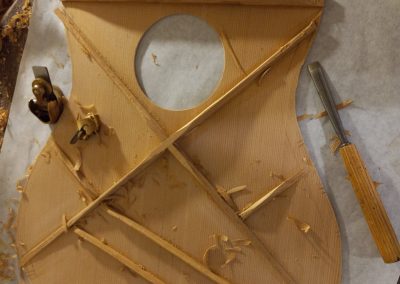 Top braces in the process of being carved